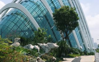 huge domed greenhouse with trees in front of it